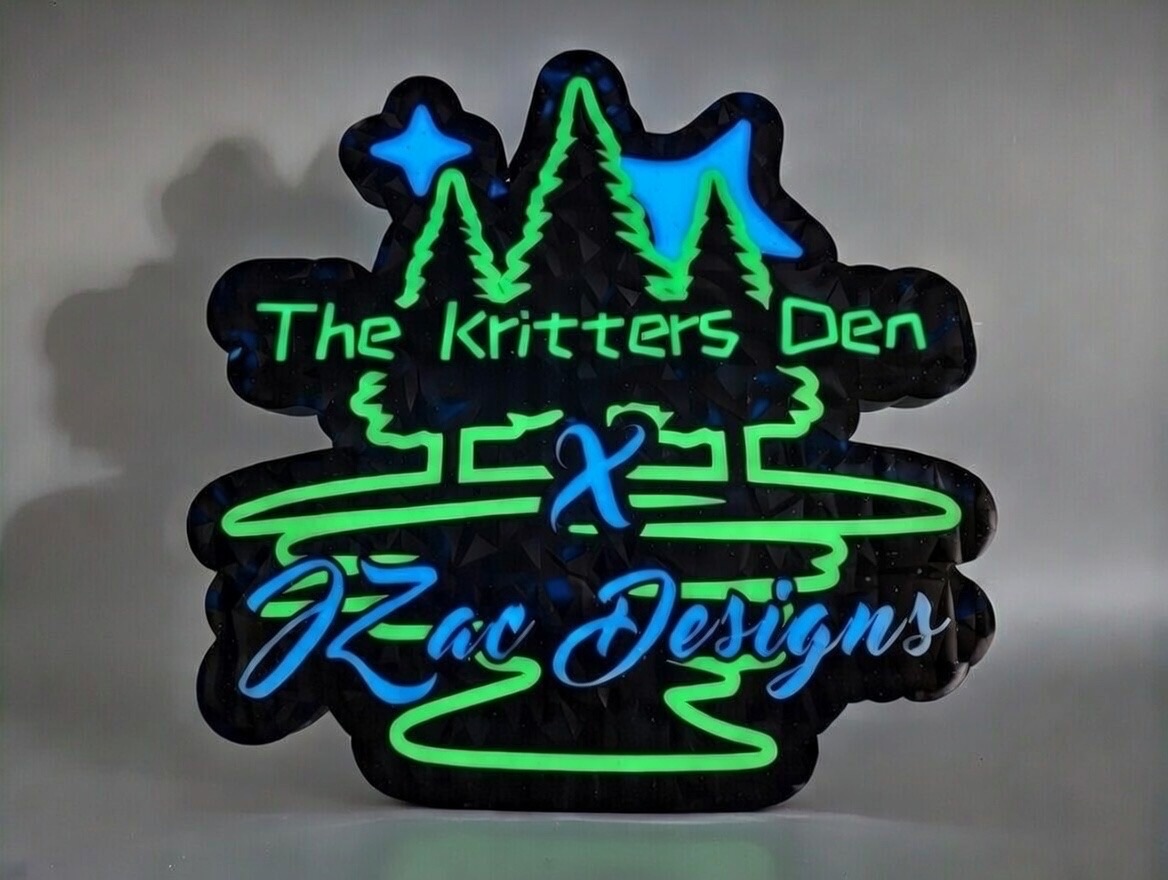 The Kritters Den custom LED logo sign, lit in green and blue